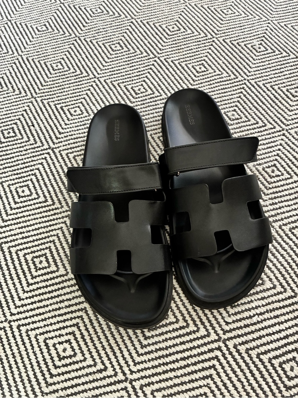 Hermès Black Leather Slide Sandals with Embossed Logo